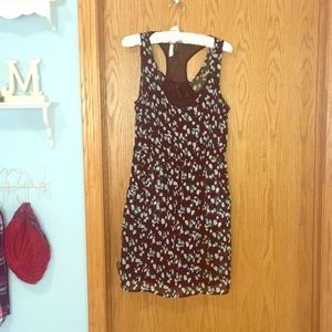 Patterned knee length dress with pockets.